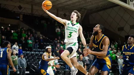 Uelmen Breaks Freshman Scoring Record, Hawks Run Past Roos on Senior Night