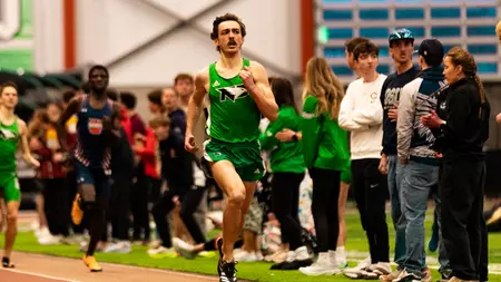 Distance Runners and Throwers Shine in Friday Action